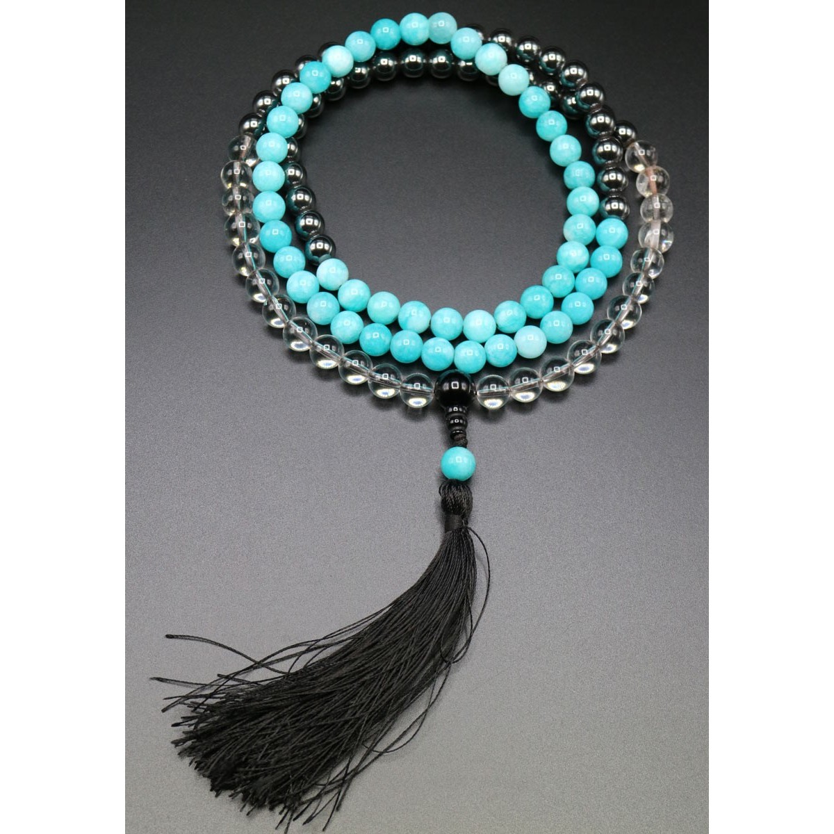 Mala 108 grani Cristallo, Acqua Marina e Ematite con nappa Mala 108 grani Cristallo, Acqua Marina e Ematite con nappa